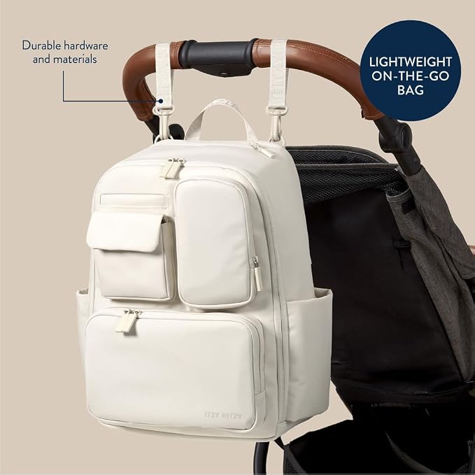 Itzy Ritzy Utility Diaper Bag Backpack, 17 Pockets w/Changing Pad (Cream) | Travel-Ready Diaper Backpack with 2 Insulated Bottle Holders, Laptop Compartment, Trolley Sleeve, Straps, and Changing Pad - Image 5
