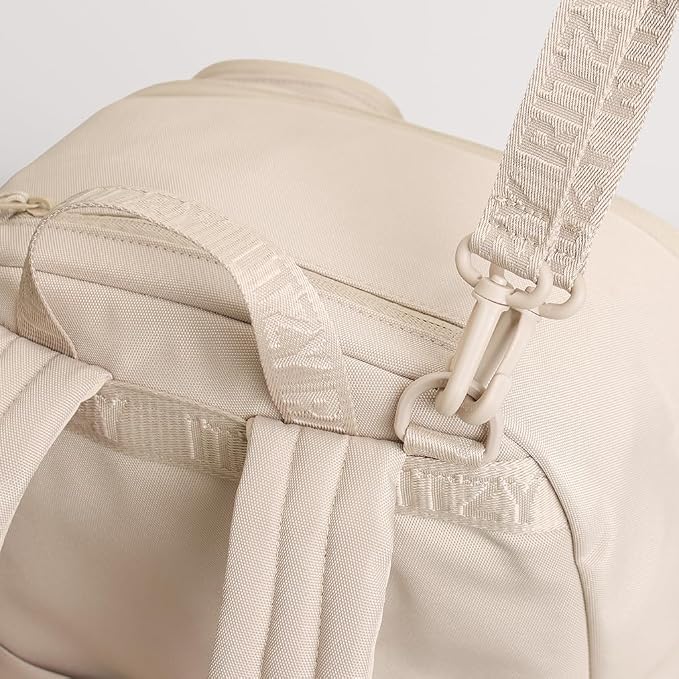 Itzy Ritzy Utility Diaper Bag Backpack – Features 17 Pockets (Including 2 Insulated Bottle Holders) & Trolley Sleeve and Includes Stroller Straps & Changing Pad – Part of The Belong Collection (Toast) - Image 8
